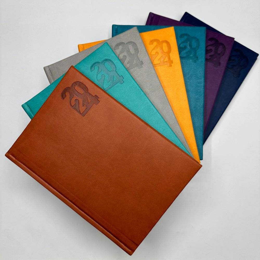 Debossed journals in brand colours